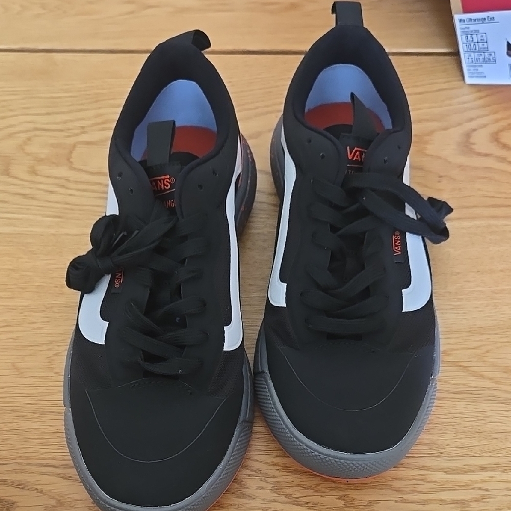 Vans Black and White Sneakers with Sleek Design